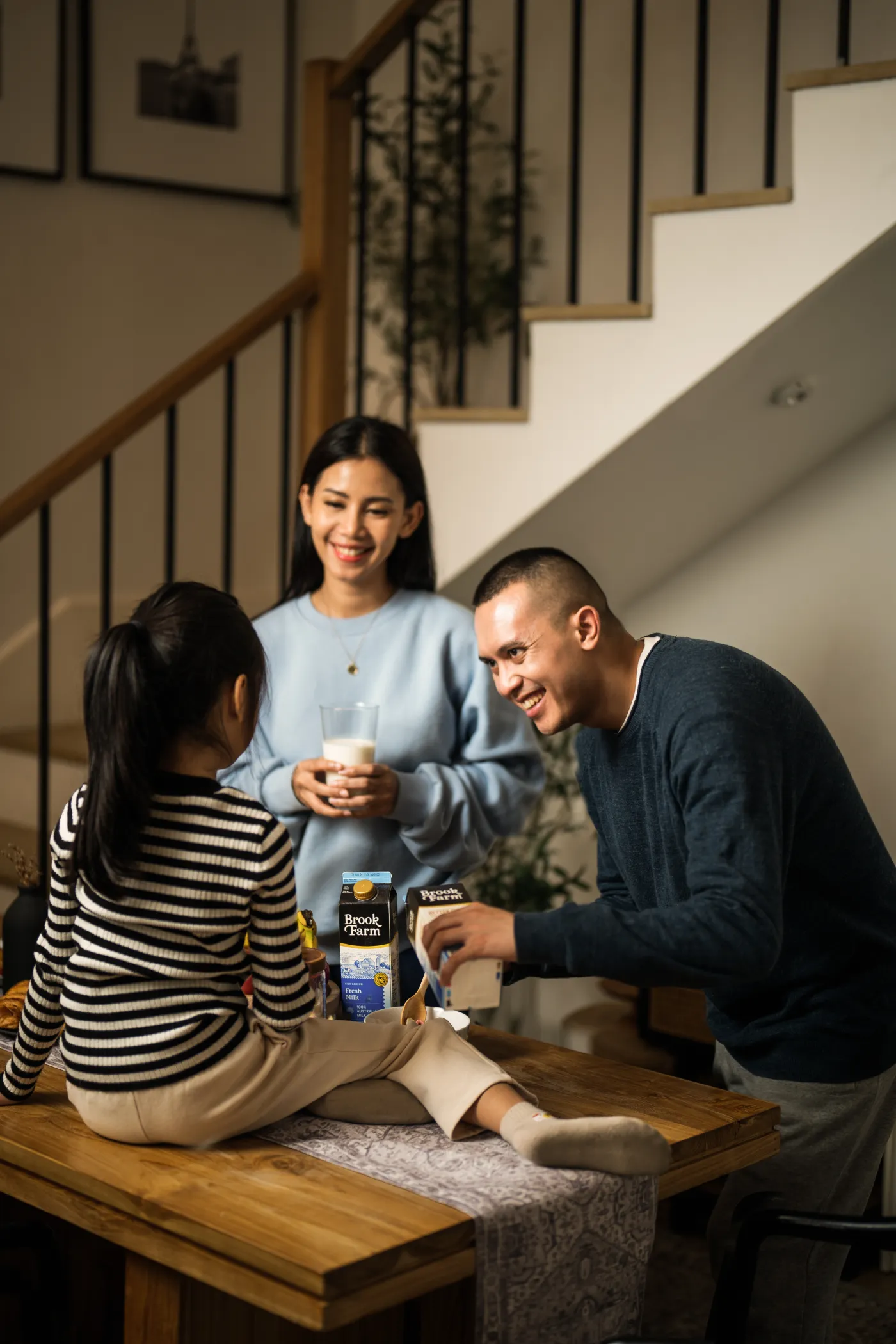 A family gathered around Brook Farm fresh milk