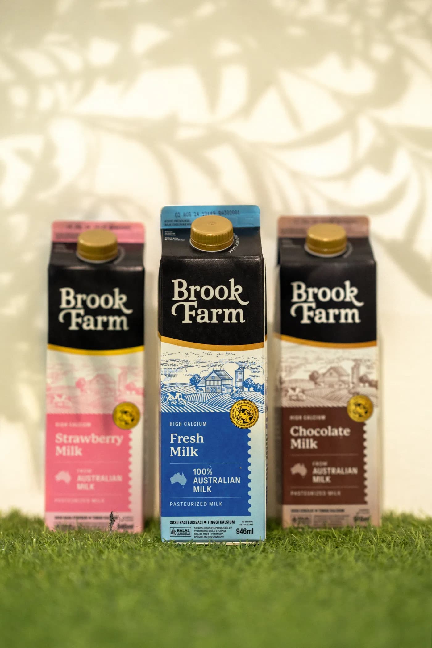 Brook Farm strawberry, fresh, and chocolate milk cartons made from Australian milk